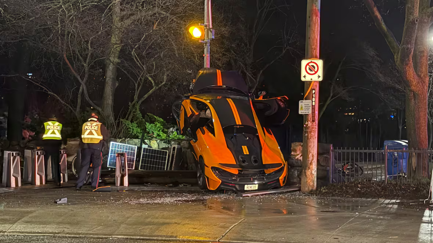 Bright orange McLaren crashes in Toronto; ends up pointing skyward